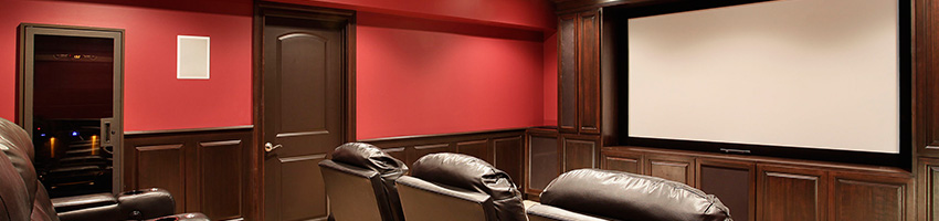 red walls and dark wood home theater